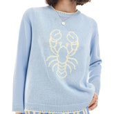 Light blue sweater with a yellow lobster design